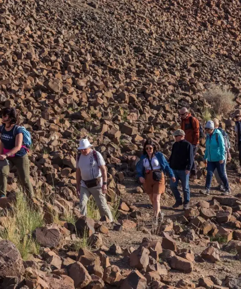 Group of tourists collecting quartz, chalcedony, agate, and amethyst at Sidi Rahal mine during Morocco fossil and mineral tour from Marrakech